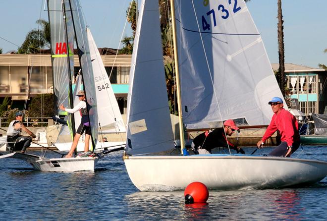 Chris Raab (l) in his Lido 14 fights off the Gibbs before they invevitably passed in their 49er © Rich Roberts
